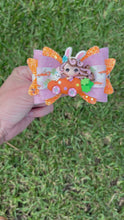 Load and play video in Gallery viewer, Carrot Car Girl clay bow
